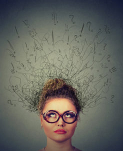 Woman having trouble gathering her thoughts; concept of brain fog